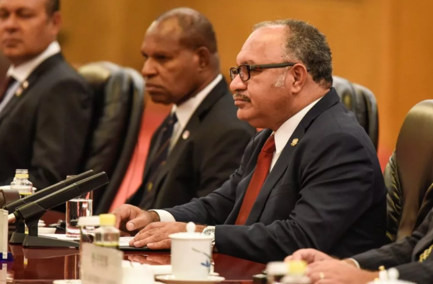 Hon. Peter O'Neill with the PNG delegation in formal session